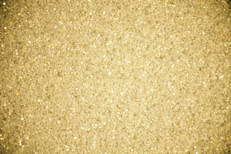 A background with a yellow texture for graphic resourceの写真素材