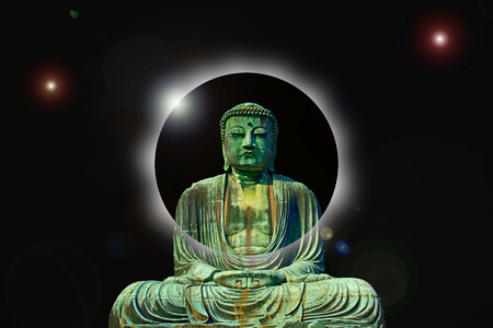 Image of a buddha meditating with space in the backgroundの写真素材