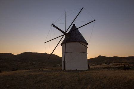 Windmill on the mountain at sunset, Almeria, Spainの写真素材