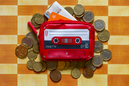 Cassete shaped purse on top of a table with orange squaresの写真素材