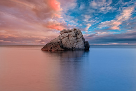A blue and golden sunset on the island of Ibiza, Spainの写真素材