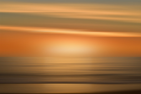 A background similar to the sea in a beautiful sunriseの写真素材