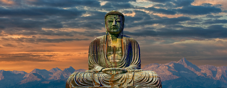 A Image of buddha with mountains at dawn backgroundの写真素材