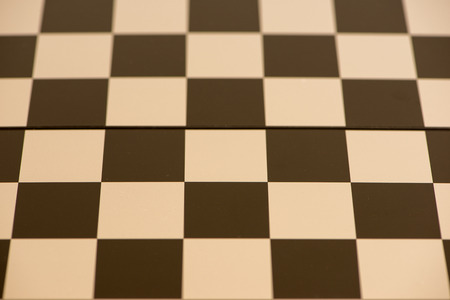 The figure of a buddha meditating on top of a wooden tableの写真素材