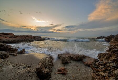 Cloudy sunrise on the coast of Oropesa del Mar, Spainの写真素材