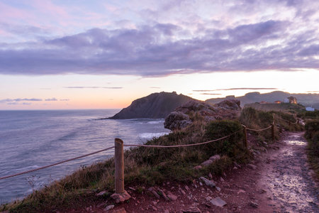 Road by the sea in the town of Zumaia, Basque Country, Spain