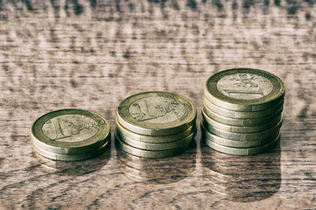 Several euro coins on a wooden table, Spain