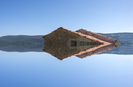A lake in the mountain under the blue sky, manipulationの写真素材