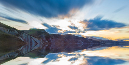Mountain reflections and clouds in the water, mounting