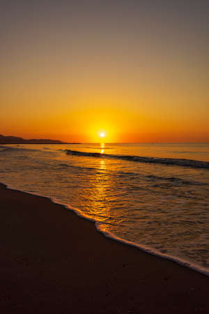 A peaceful sunrise on a beach on the Costa Azahar, Spainの写真素材