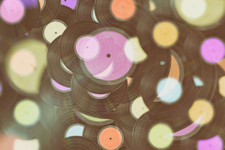 Background with several old vinyl records to play musicの写真素材
