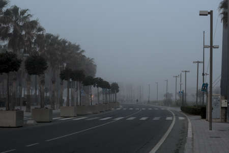 the fog blurs the road in the distanceの写真素材