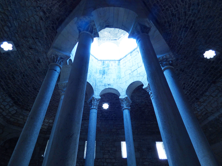 Blue light above columns in arab bathの写真素材