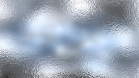 Soft light reflects off a textured surface, creating an abstract and dreamy effect. The blurred patterns give a sense of fluid movement and tranquility in the scene.の素材