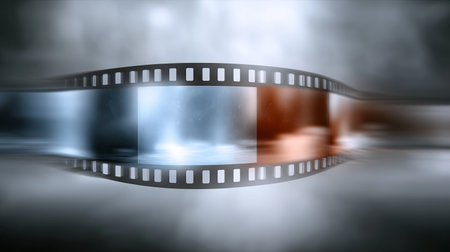 Film strip with colorful frames moving in a foggy backgroundの素材