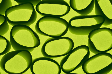 small green objects on a bright background, the object shape is curvilinear, silhouette effect, seamless shapeの写真素材