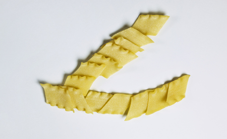 Dry  Italian pasta called pantacce ,rhombus-shaped pasta with wavy edge.の写真素材