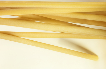 A group of Italian pasta called ziti on a white background.の写真素材
