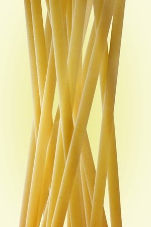 A group of Italian pasta called linguine on a  light background.の写真素材