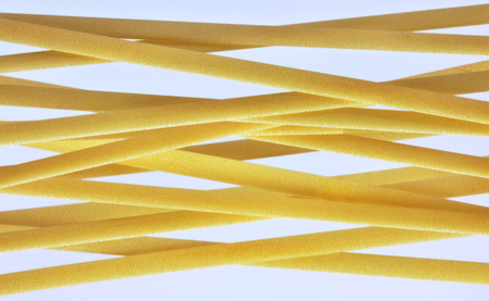 A group of Italian pasta called linguine on a  light background.の写真素材