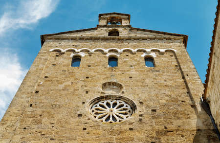ANAGNI-ITALY-July 2020- part of cathedral southern side wall with rose window, windows and bellの写真素材