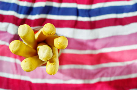 Breadsticks on colored backgroundの写真素材