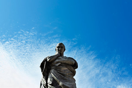 Bronze statue of the Roman poet Ovid against blue sky symbol of the city of Sulmona, birthplace of Ovidのeditorial素材