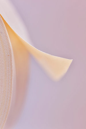 Detail of white adhesive tape on white background, place of work