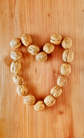 Fruit of walnuts in heart shaped, healthy eating, nutritional supplement