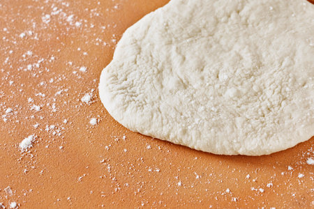 Pastry dough on table before baking, preparing foodの写真素材