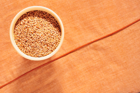 Bowl with roasted sesame seeds common ingredient in many cuisinesの写真素材