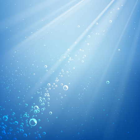 Bubbles in the water on a background of light rays