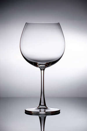 Empty Wine Glass with Clear White Backgroundの写真素材