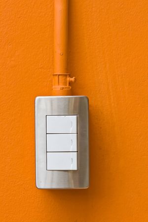 Light Switches on Orange Wallの写真素材