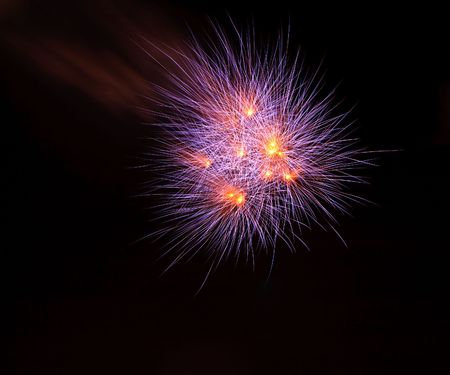 Orange and Violet  Fireworks on Dark Skyの写真素材