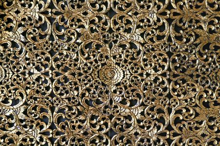 Thai Traditional Golden decoration on Wallの写真素材