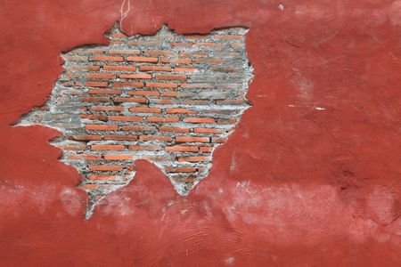 Cracking grunge weathered vintage and fragment of Red brick wall using as backgroundの写真素材