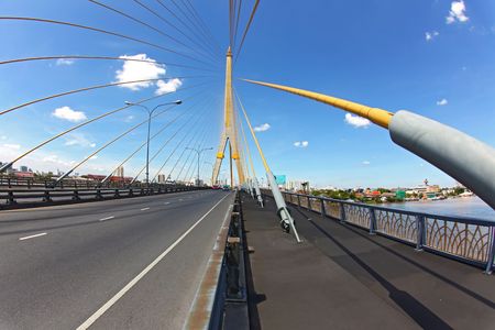 Mega sling Bridge,Rama 8, near Harbor with beautiful sunny in Bangkok, fish eye perspectiveの写真素材