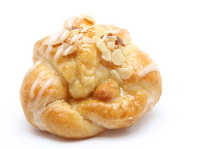 isolated almond croissant on white backgroundの写真素材
