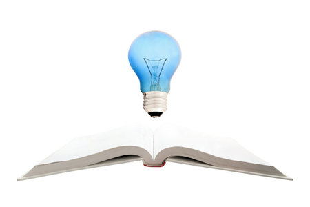 concept of Retro book and light bulb, isolated on white backgroundの写真素材
