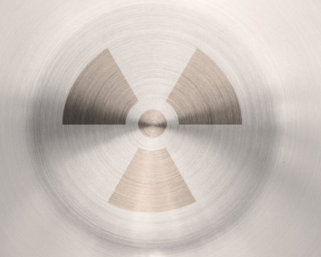 grunge nuclear sign on metal texture background