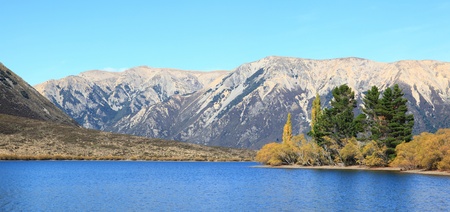 Panorama southern alpine alps mountain range at Lake Pearson Arthur's pass National Park New Zealandの写真素材