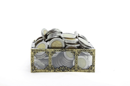 studio shot of open chest with full wealth coins money insideの写真素材