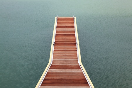 new wooden jetty walkway pier of marina on seaの写真素材