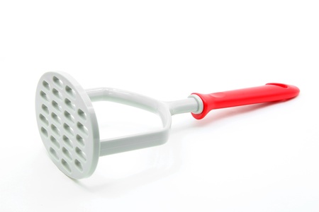 studio shot of plastic potato masher isolated on white backgroundの写真素材