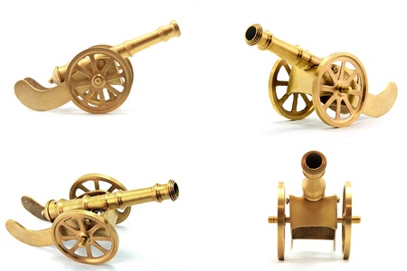 collection of golden metal cannon antique isolated on white backgroundの写真素材