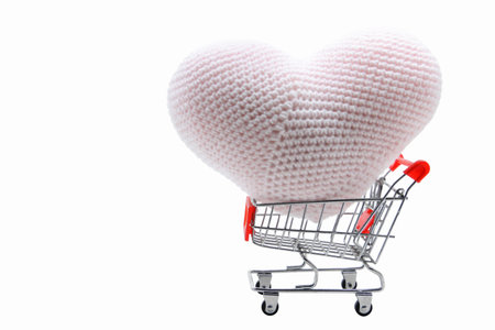 heart delivery in Shopping cart isolated on whiteの写真素材