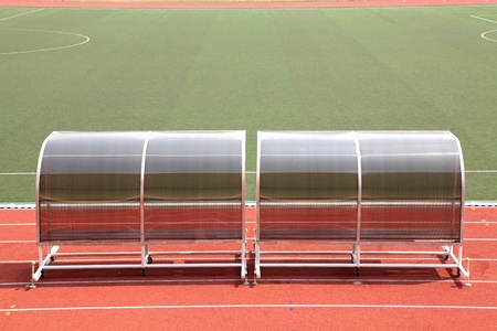 Coach and reserve benches in football soccer stadiumの写真素材