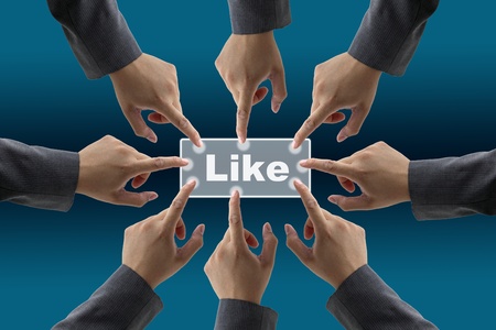 team of businessman push on like button for teamwork conceptの写真素材