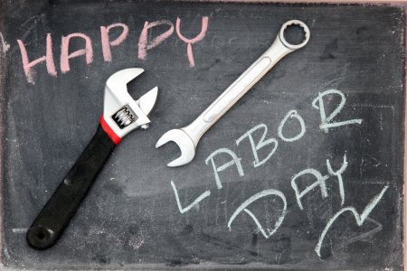 Happy Labor Day on blackboard with wrenchの写真素材